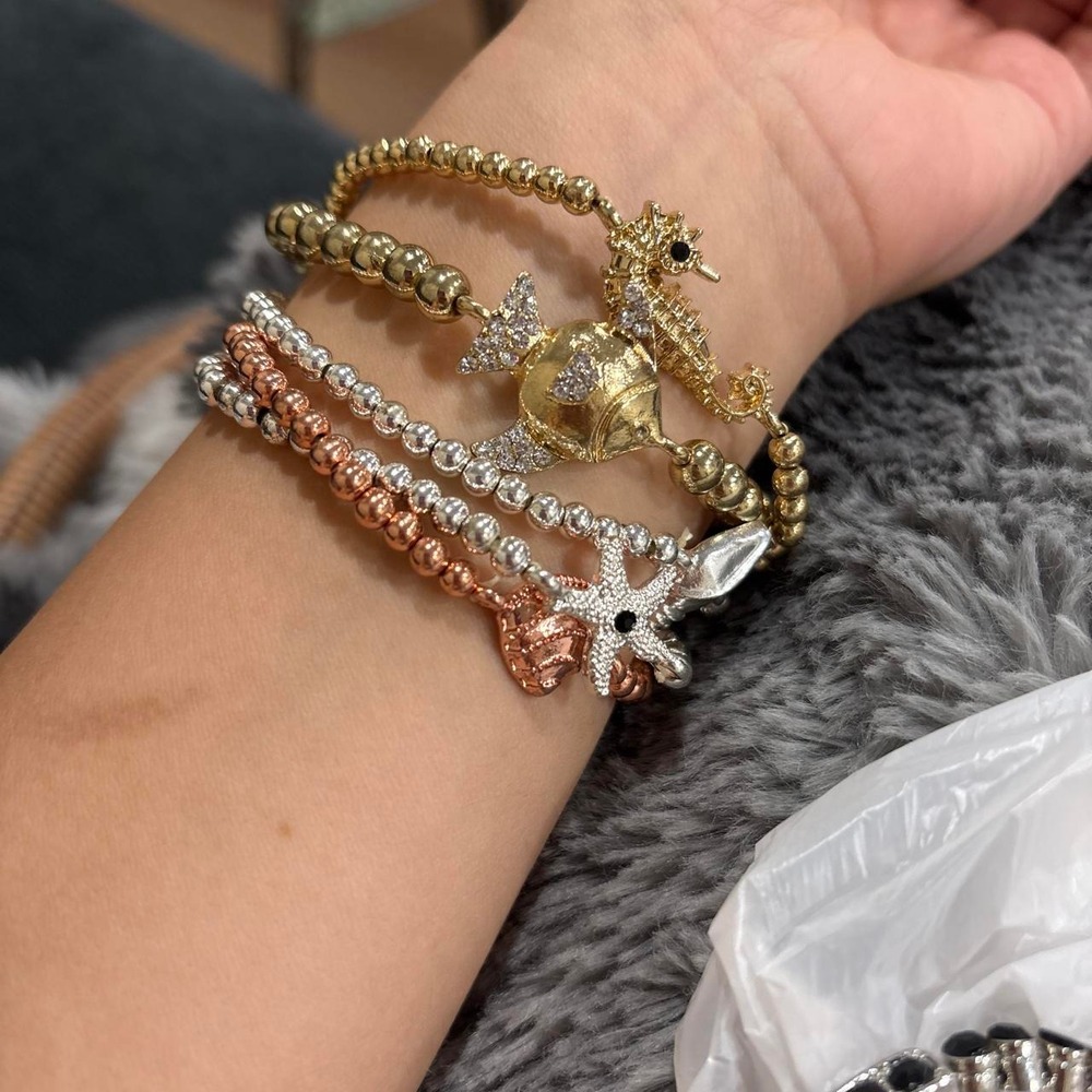 22-Multi-colored beaded bracelets with seahorse and starfish charm